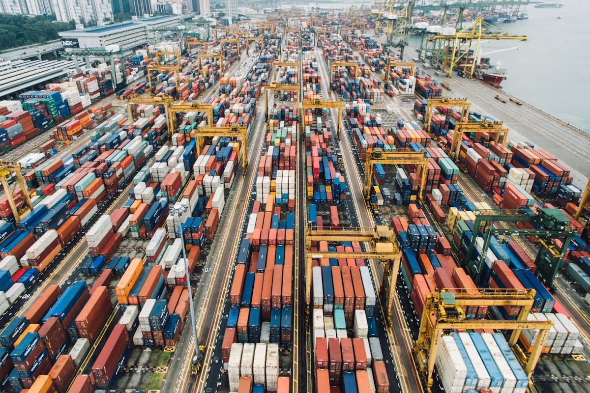 Aerial view of a container port terminal — end-to-end export logistics